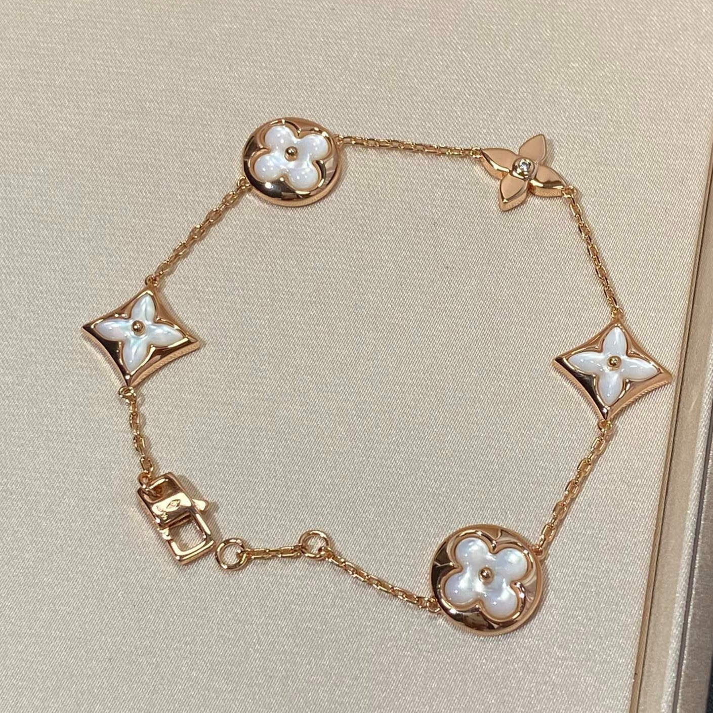 [Spark]STAR AND SUN 5 MOTIF MOP PINK GOLD BRACELET